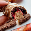 Warrior Crunch Peanut Butter and Jelly protein bar with crunchy crispies