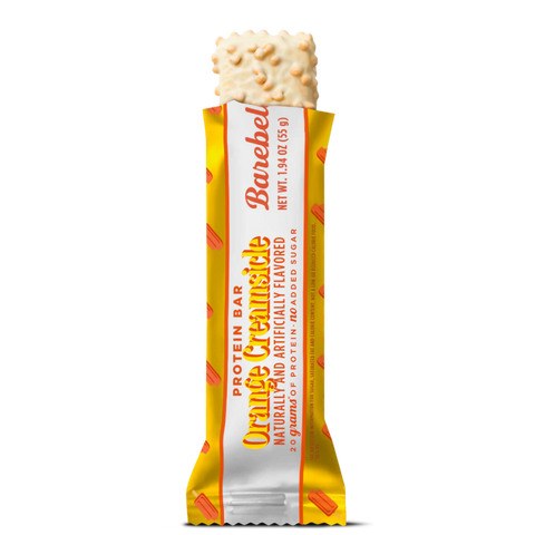 Baton proteinowy Guiltfree Barebells Orange Creamsicle w żółtym opakowaniu z białą polewą i pomarańczową posypką