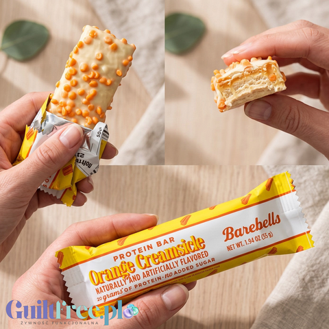 Baton proteinowy Guiltfree Barebells Orange Creamsicle w białej polewie z pomarańczową posypką i kremowym wnętrzem