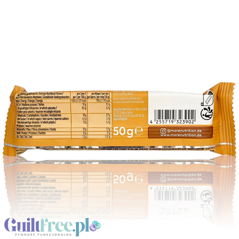 Tylna strona opakowania batona proteinowego Guiltfree More Nutrition o smaku banana, orzeszków i karmelu z tabelą