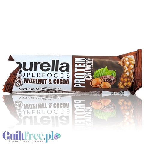 Baton proteinowy Guiltfree Purella Superfoods o smaku orzecha laskowego i kakao w brązowym opakowaniu z grafiką orzechów