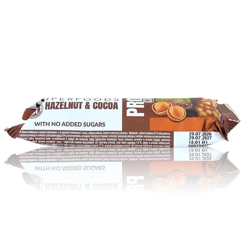 Guiltfree Purella Superfoods baton proteinowy o smaku orzecha laskowego i kakao w brązowym opakowaniu