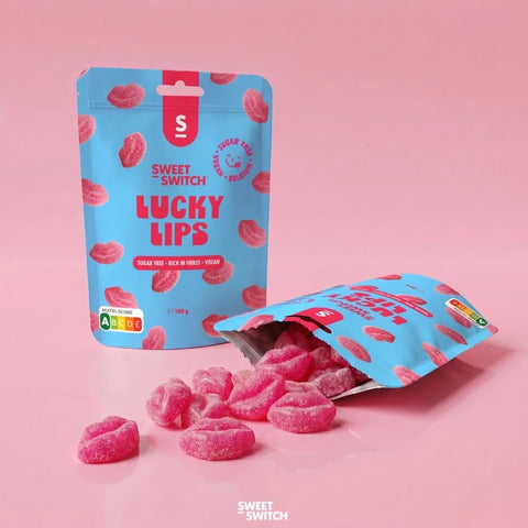 Guiltfree Sweet Switch Lucky Lips to wegańskie żelki malinowe bez cukru w kształcie różowych ust w niebieskim opakowaniu