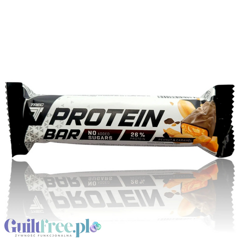Baton proteinowy Guiltfree Trec Protein Peanut & Caramel w białym opakowaniu z widocznym nadzieniem orzechowo-karmelowym